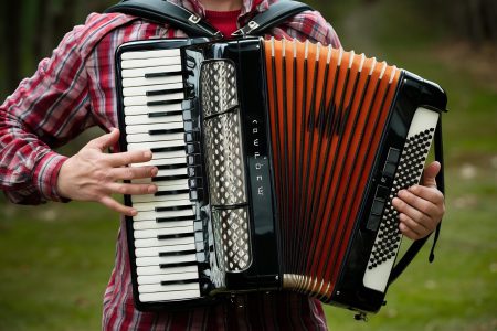 closeup-view-person-holding-playing-accordion